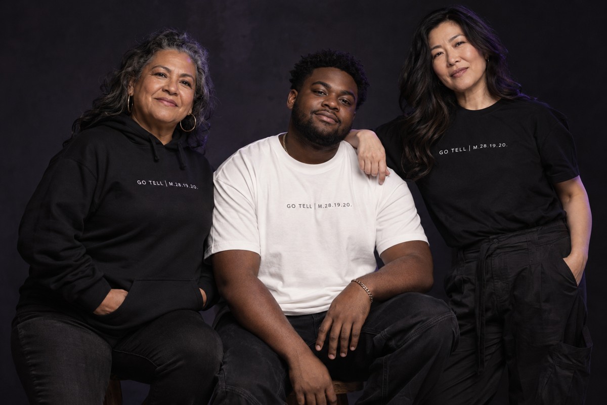 A diverse group of models wearing black and white Gather apparel