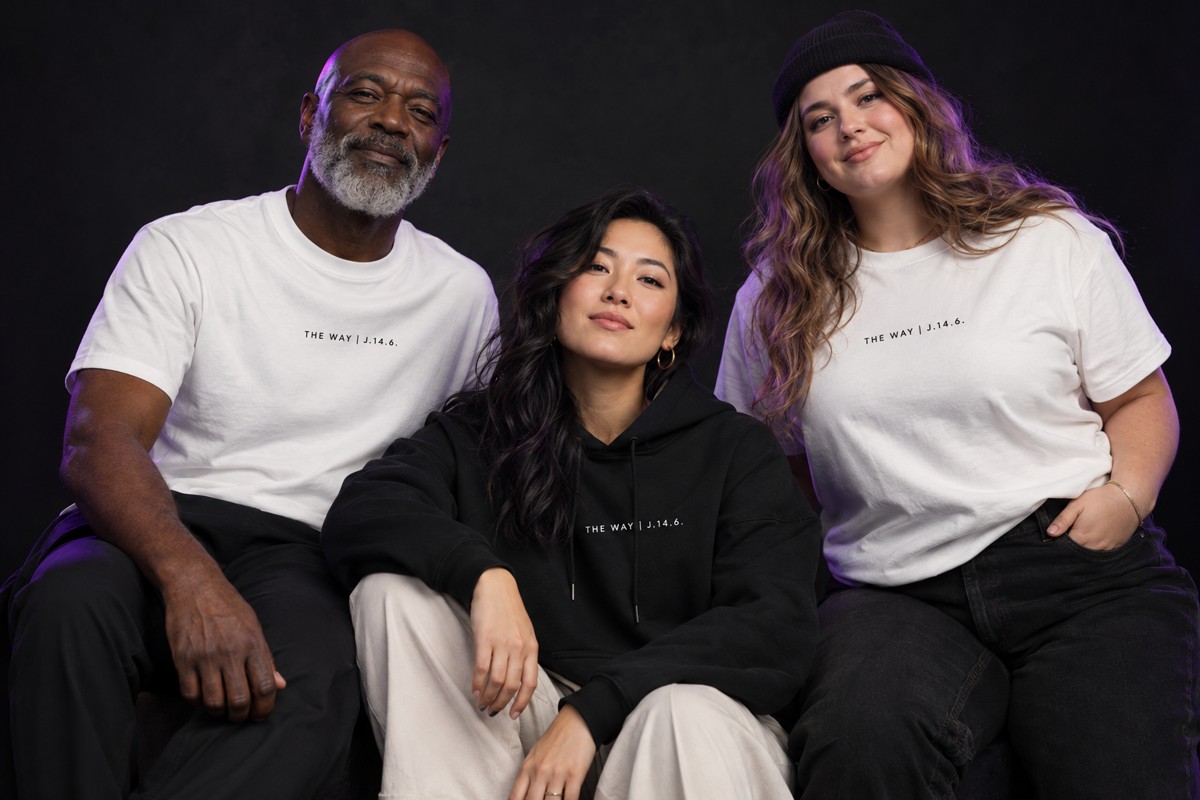 A diverse group of models wearing black and white The Way apparel