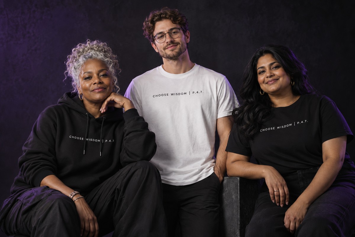 A diverse group of models wearing black and white Wisdom apparel
